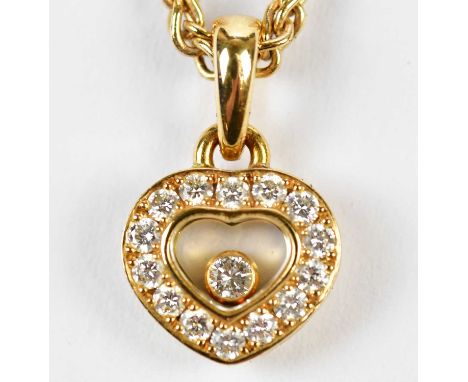 CHOPARD; an 18ct yellow gold and diamond set 'Happy Diamonds' pendant on chain, signed and numbered 9659915, 79/1084, length 