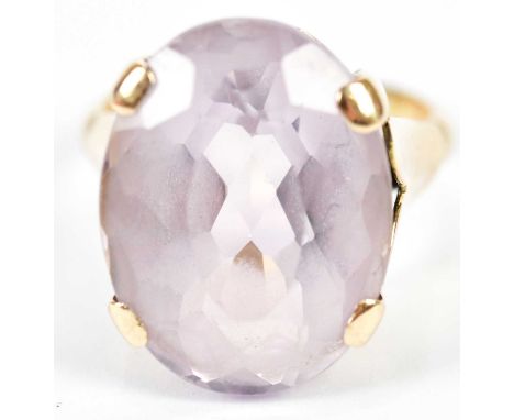 A yellow metal and pale amethyst dress ring with engraved initials to the interior of band, size Q, approx 10.7g.