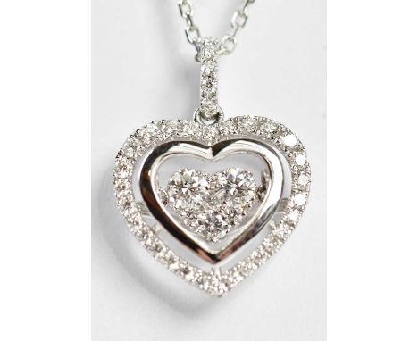 An 18ct white gold fine link chain suspending a diamond set heart shaped pendant drop in the manner of Chopard, length 44cm, 