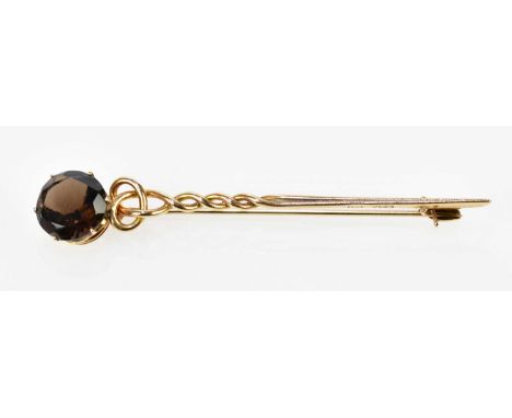 A 9ct yellow gold and quartz set Celtic inspired bar brooch, length 75mm, approx. 5.5g.