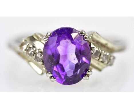 An 18ct white gold amethyst and diamond dress ring, size R, approx 4.5g.