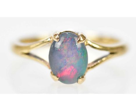 A yellow metal and doublet opal dress ring, size M, approx 2.4g.