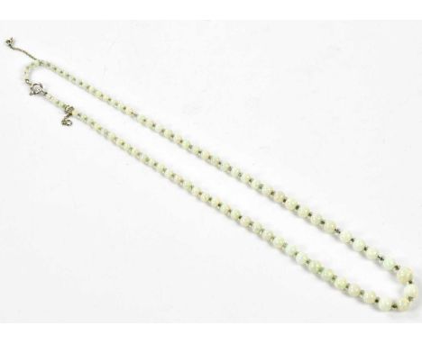 A graduated opal bead necklace formed of seventy-nine polished round opal beads graduating from 3.1mm to 7.6mm with faceted r