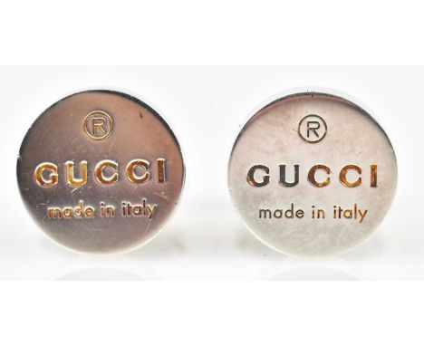 GUCCI; a pair of hallmarked silver cufflinks with embossed name logo to tab, in original pouch and box.