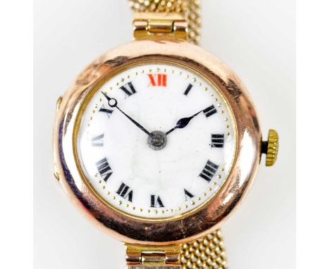 A 9ct gold wristwatch, the white enamel dial set with Roman numerals on a 9ct yellow gold strap, diameter 20mm, approx. 20.3g