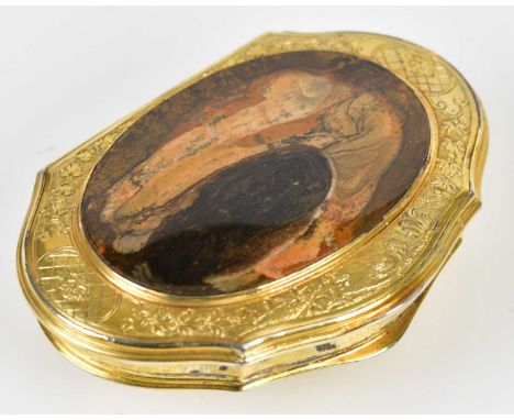 A late 18th century Continental gilt metal snuff box, the cover with applied hardstone inside a chased border, width 7cm.
