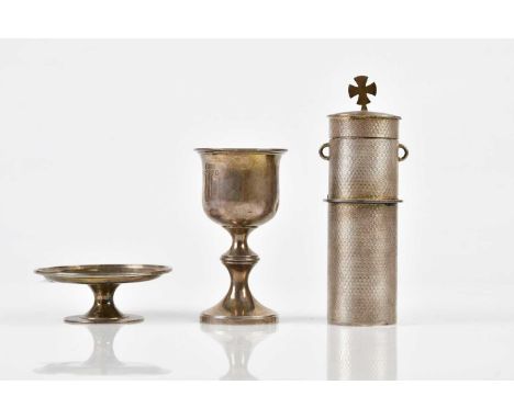 ROBERT HENNELL I; a George III hallmarked silver two piece travelling communion set, inscribed IHS, London 1823 and a white m
