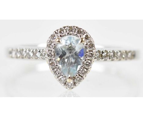 An 18ct white gold diamond and pale aquamarine pear shaped ring, size M 1/2, approx 2.8g.