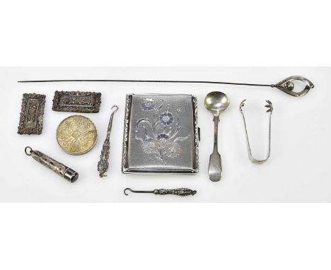 A pair of small silver sugar tongs, a silver capped hat pin, two silver handled steel bladed button hooks, also a coin brooch