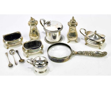 A hallmarked silver five piece cruet, a lidded hallmarked silver drum mustard with blue glass liner and a magnifying glass wi