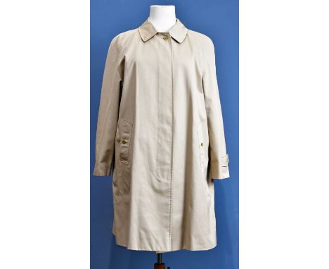BURBERRY; a beige gabardine short raincoat with a Nova Check cotton lining, light tortoiseshell front buttons, two front pock