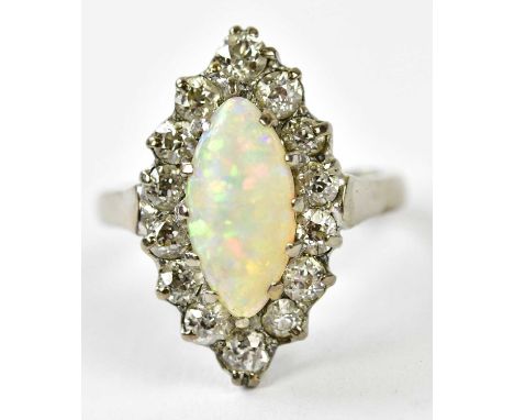 An 18ct white gold opal and diamond boat shaped cluster ring with central opal within a border of fourteen diamonds, size H, 