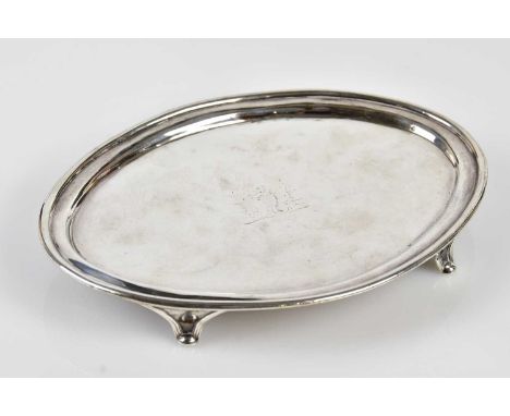 WILLIAM FRISBEE (PROBABLY); a George III hallmarked silver oval teapot stand, with engraved coat of arms, London 1794, 23 x 1