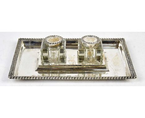 JOHN GRINSELL &amp; SONS; a late Victorian hallmarked silver ink stand of rectangular form with twin glass wells set with hin