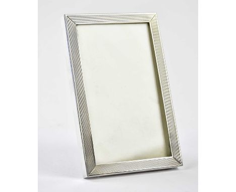 SANDERS &amp; MACKENZIE; an Elizabeth II hallmarked silver easel back photograph frame with engine turned decoration, Birming