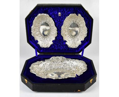 HENRY WILKINSON &amp; CO LTD; an impressive cased set of three Edwardian hallmarked silver foliate embossed fruit bowls with 