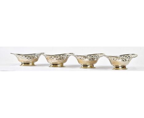 WILLIAM HUTTON &amp; SONS; a set of four George V hallmarked silver pedestal bonbon dishes with cast beaded rims, Birmingham 