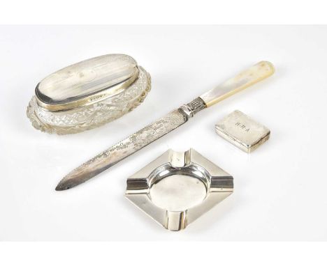 A Birmingham hallmarked silver snuff box, ashtray, and oval glass dressing table jar, also a Sheffield hallmarked bread knife