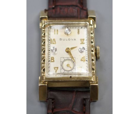 A gentleman's 1940's Art Deco '10k gold filled' Bulova rectangular manual wind wrist watch, with Arabic dial, three diamond s