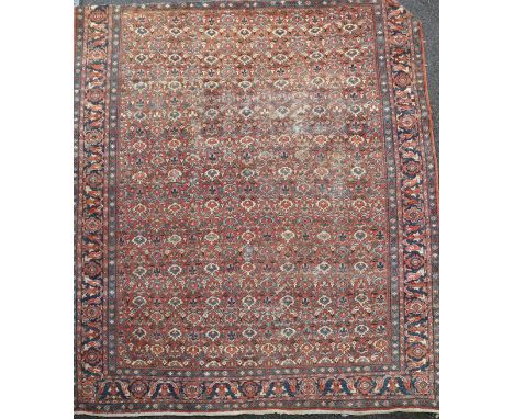 A Mahal red ground carpet, with field of geometric foliate motifs, 386 x 327cm Condition: The carpet has been cut(reduced) at