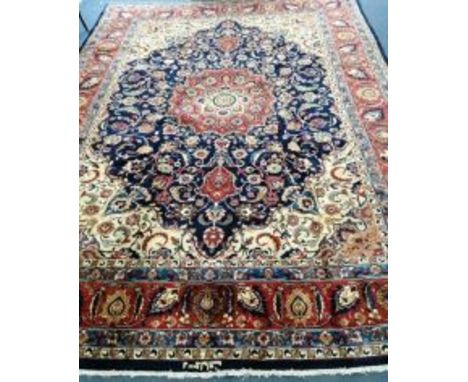 A Tabriz blue ground carpet, 340 x 245cm Condition: Good condition