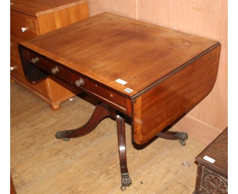 A Regency satinwood banded mahogany sofa table, extended W.144cm D.69cm H.70cm Condition: The top is faded with a circular wa