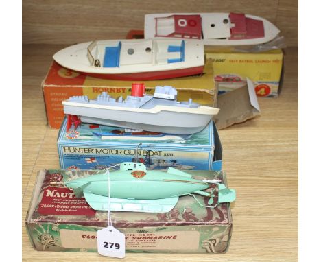 A boxed Sutcliffe model tinplate clockwork nautilus submarine, a boxed Scalex Hunter motor gun boat and two Hornby plastic bo