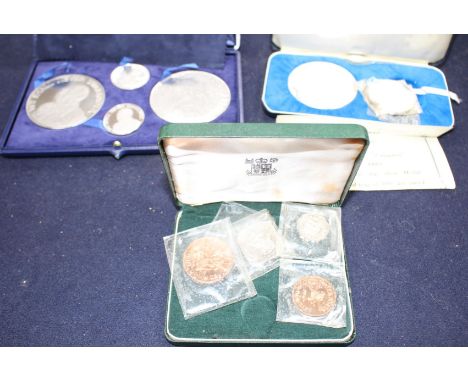 A set of the Kings and Queens of England sterling silver proof medallions, housed in original album and three other cased set