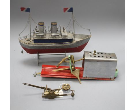 A 1950's Mamod ME1 clockwork steam engine, a Vane gear for a pond yacht and a modern painted metal model of a boat Condition: