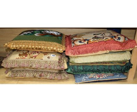 Seven antique / antique fabric cushions Condition:- pair of floral tapestry panel cushions with matching fringes and pale gol
