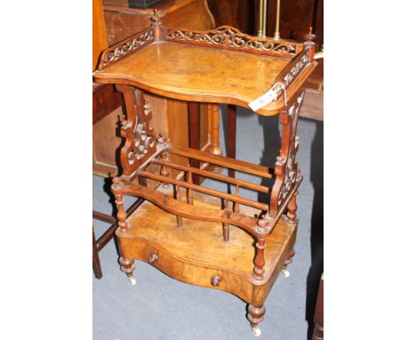 A Victorian walnut whatnot canterbury, with serpentine front and base drawer, W.58cm D.36cm H.97cm Condition: A little faded 
