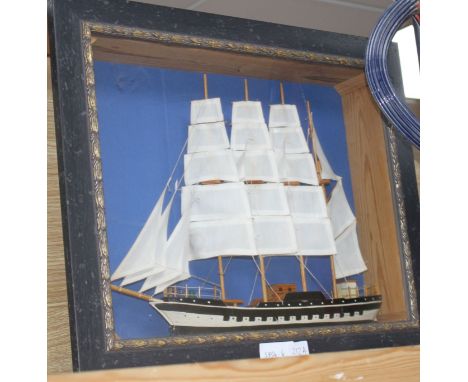 A painted wood ship model, in display frame, overall 42 x 52cm Condition: Sails looks a little faded otherwise good