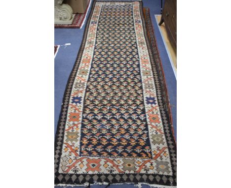 A Shah Savan Kelim runner, with central black ground of stylised floral motifs, 242 x 98cm Condition: A little faded but stil