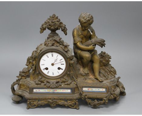 A late 19th century French ormolu mantel clock, with enamelled dial signed C. Detouche... Paris, height 28cm, width 36cm Cond
