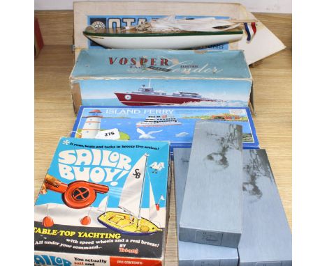 A boxed Star model pond yacht, a Tri-ang boxed Sailor Buoy table top yachting set, a Victory Industries plastic electric powe