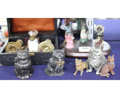 A group of assorted ornaments all relating to cats, comprising: boxed four piece desk set, a painted spelter three cat orname