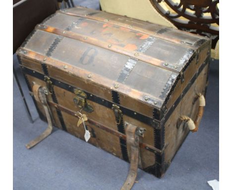 An early 20th century cabin trunk by Friedrich Wallauer of Darmstadt, with black painted metal banding, brass mounts and orig