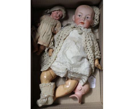 A Heubach character doll, intaglio eyes on shoulder plate broken, 18in., a Heubach character baby, intaglio eyes, hard body, 