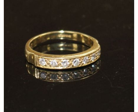 A modern 18ct gold and seven stone diamond set half eternity ring, size R, gross weight 4.9 grams. Condition: Total diamond w