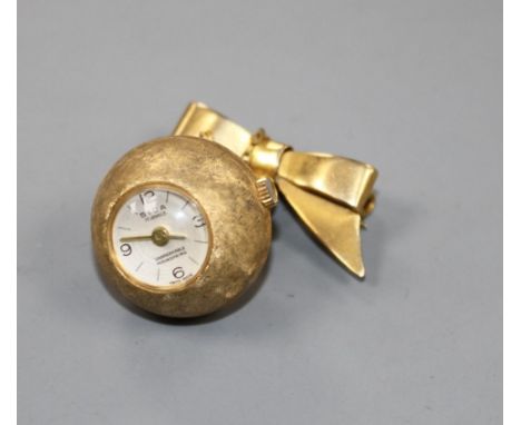 A gilt metal Sica globe manual wind fob watch, on a 9ct ribbon suspension brooch and a continental 9k fob watch. Condition: G