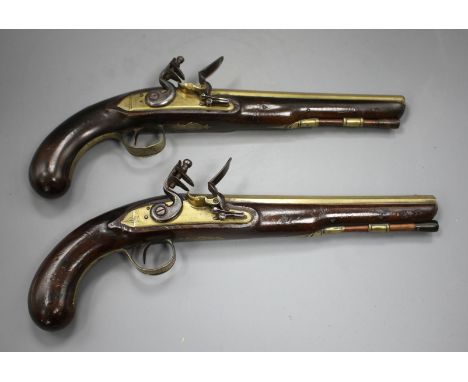 A pair of flintlock holster pistols by W. Ketland &amp; Co, late 18th century, brass barrels 9" engraved London with Tower pr