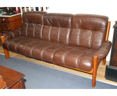 A mid century Danish Ekornes teak and leather Amigo three seater sofa, W.210cm D.88cm H.88cm Condition: Overall looks to be i