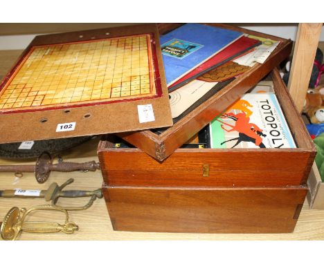A quantity of assorted toys and games in a stacking three tier box Condition:- Dr Magini - Flotilla- Millionaire- Never Say D