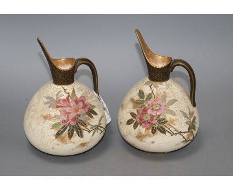 A pair of Doulton Burslem ewers, with floral decoration, US Patent stamp to base, height 17.5cm Condition: Both rather dirty 