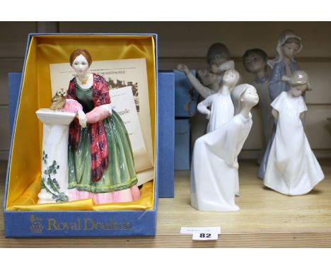 Four Lladro figures of children in their nightdresses, largest 24cm, three similar Nao figures, largest 27cm and a Royal Doul