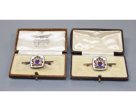 A modern pair of silver gilt and enamel brooches, decorated with ornate crest, 42mm, gross weight 14.6 grams. Condition: Meta