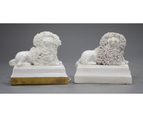 Two Staffordshire porcelain figures of recumbent poodles, c.1830-50, possibly Lloyd Shelton, the biscuit example has small fi