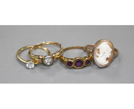 Four assorted 9ct and gem set rings. Condition: 9ct gold and collet set solitaire diamond ring, size R, gross weight 2 grams.