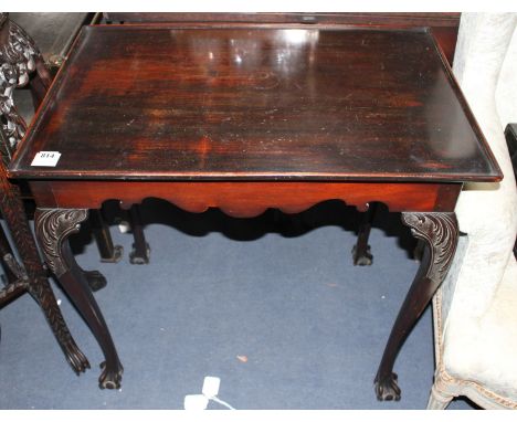 A George II style mahogany silver table, with dished rectangular top and acanthus carved cabriole legs with claw and ball fee