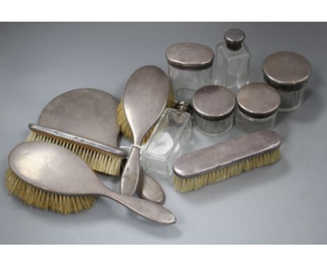 A George V eleven piece silver mounted dressing table set, by Asprey &amp; Co, London, 1928, mirror 27.2cm. Condition: All pi